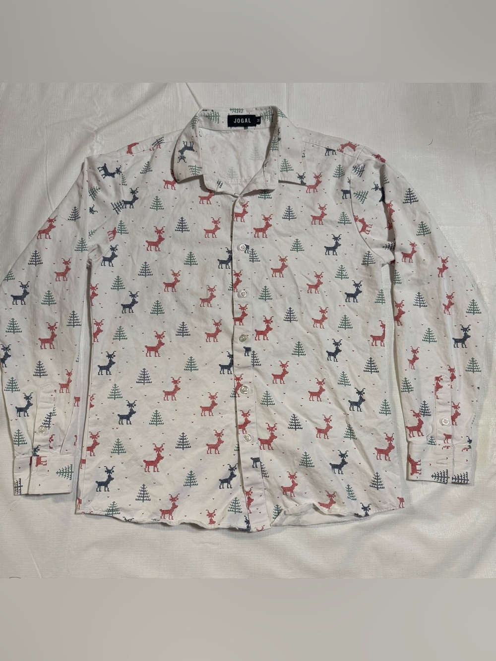 Jogal christmas shirt with red, black , and green deer and tree pattern , size M